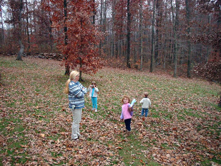 Everyone playing in the leaves.jpg 99.1K